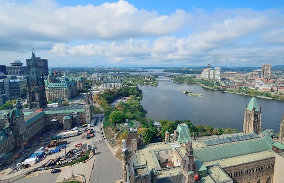 Cityscape with river, bridges, and prominent architecture including Parliament Buildings